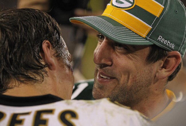 GREEN BAY, WI - SEPTEMBER 08: Aaron Rodgers #12 of the Green Bay Packers talks with Drew Brees #9 of the New Orleans Saints after the NFL opening season game at Lambeau Field on September 8, 2011 in Green Bay, Wisconsin. The Packers defeated the Saints 42-34. (Photo by Jonathan Daniel/Getty Images)