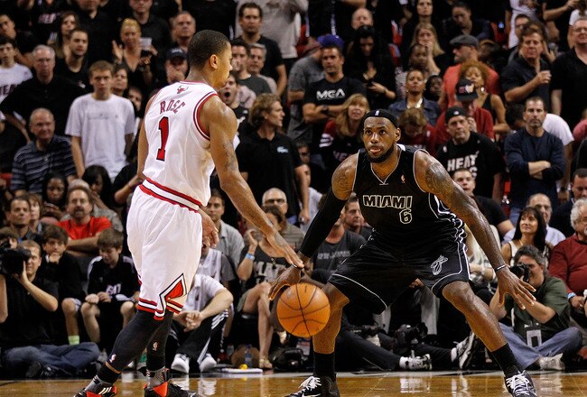 MIAMI, FL - JANUARY 29:  Derrick Rose #1 of the Chicago Bulls is guarded by LeBron James #6 of the Miami Heat during a game at American Airlines Arena on January 29, 2012 in Miami, Florida. NOTE TO USER: User expressly acknowledges and agrees that, by downloading and/or using this Photograph, User is consenting to the terms and conditions of the Getty Images License Agreement.  (Photo by Mike Ehrmann/Getty Images)