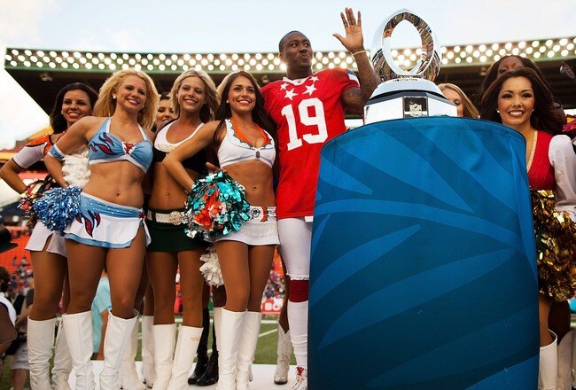 HONOLULU, HI - JANUARY 29:  Brandon Marshall #19 of the Miami Dolphins poses with the Pro Bowl Cheerleaders after the 2012 NFL Pro Bowl at Aloha Stadium on January 29, 2012 in Honolulu, Hawaii.  (Photo by Kent Nishimura/Getty Images)