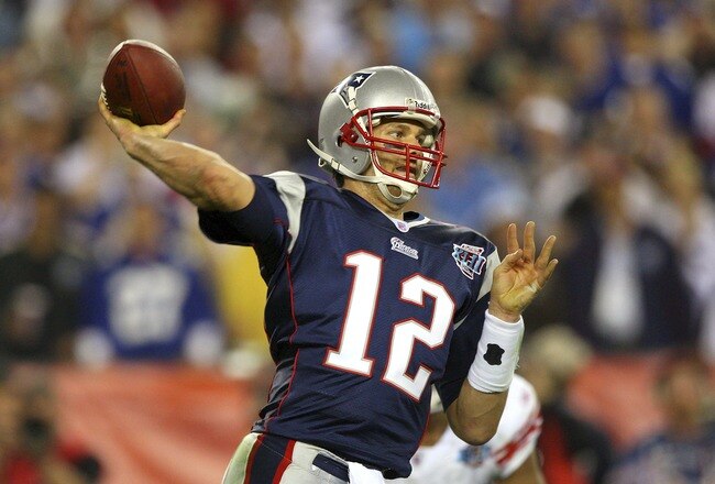 GLENDALE, AZ - FEBRUARY 03:  Quarterback Tom Brady #12 of the New England Patriots drops back to pass against the New York Giants the second half of Super Bowl XLII on February 3, 2008 at the University of Phoenix Stadium in Glendale, Arizona. The Giants defeated the Patriots 17-14.  (Photo by Donald Miralle/Getty Images)