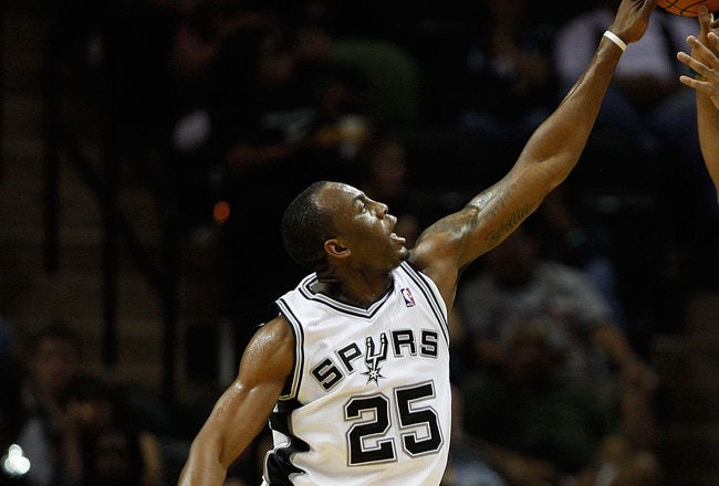 SAN ANTONIO - OCTOBER 09:  Kenny Hasbrouck #4 of the Miami Heat has a shot blocked by James Anderson #25 of the San Antonio Spurs at the AT&T Center on October 9, 2010 in San Antonio, Texas.  NOTE TO USER: User expressly acknowledges and agrees that, by downloading and/or using this Photograph, User is consenting to the terms and conditions of the Getty Images License Agreement.  (Photo by Chris Graythen/Getty Images)