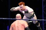 DURBAN, SOUTH AFRICA - JULY 08:  The Celtic Warrior Sheamus leaps towards the Big Red Monster Kane during the WWE Smackdown Live Tour at Westridge Park Tennis Stadium on July 08, 2011 in Durban, South Africa.  (Photo by Steve Haag/Gallo Images/Getty Images)