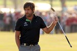 ABU DHABI, UNITED ARAB EMIRATES - JANUARY 29:  Robert Rock of England acknowledges the crowd on the 18th green on his way to winning The Abu Dhabi HSBC Golf Championship at Abu Dhabi Golf Club on January 29, 2012 in Abu Dhabi, United Arab Emirates.  (Photo by Andrew Redington/Getty Images)