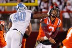 BLACKSBURG, VA - NOVEMBER 17: Logan Thomas #3 of the Virginia Tech Hokies is struck in the head after throwing the ball by Quinton Coples #90 of the North Carolina Tar Heels at Lane Stadium on November 17, 2011 in Blacksburg, Virginia. (Photo by Geoff Burke/Getty Images)