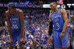 DALLAS, TX - MAY 25:  Kevin Durant #35 and Russell Westbrook #0 of the Oklahoma City Thunder stand next to each other on the court in the fourth quarter while taking on the Dallas Mavericks in Game Five of the Western Conference Finals during the 2011 NBA Playoffs at American Airlines Center on May 25, 2011 in Dallas, Texas. NOTE TO USER: User expressly acknowledges and agrees that, by downloading and or using this photograph, User is consenting to the terms and conditions of the Getty Images License Agreement.  (Photo by Ronald Martinez/Getty Images)