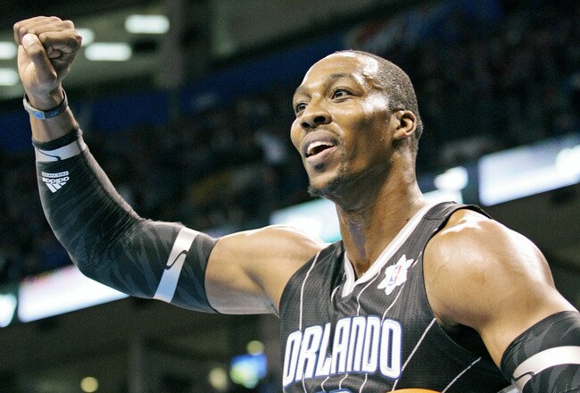 OKLAHOMA CITY, OK - DECEMBER 25:  Dwight Howard #12 of the Orlando Magic looks to have a foul called during the NBA season opening game against the Oklahoma City Thunder December 25, 2011 at the Chesapeake Energy Arena in Oklahoma City, Oklahoma.  Oklahoma City defeated Orlando 97-89. NOTE TO USER: User expressly acknowledges and agrees that, by downloading and or using this Photograph, user is consenting to the terms and conditions of the Getty Images License Agreement.  (Photo by Brett Deering/Getty Images)