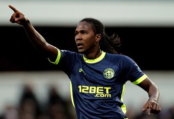 LONDON, ENGLAND - JANUARY 21:  Hugo Rodallega of Wigan celebrates after scoring a goal from a free kick during the Barclays Premier League match between Queens Park Rangers and Wigan Athletic at Loftus Road on January 21, 2012 in London, England.  (Photo by Paul Gilham/Getty Images)