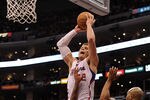 LOS ANGELES, CA - JANUARY 14:  Blake Griffin #32 of the Los Angeles Clippers is fouled as he attempts a dunk on Matt Barnes #9 and Derek Fisher #2 of the Los Angeles Lakers during a 102-94 Clipper win at Staples Center on January 14, 2012 in Los Angeles, California.  NOTE TO USER: User expressly acknowledges and agrees that, by downloading and/or using this Photograph, user is consenting to the terms and conditions of the Getty Images License Agreement.  (Photo by Harry How/Getty Images)