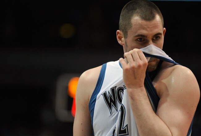 MINNEAPOLIS, MN - APRIL 1: Kevin Love #42 of the Minnesota Timberwolves reacts to a foul during the second half of a basketball game against the Miami Heat at Target Center on April 1, 2011 in Minneapolis, Minnesota. Heat defeated the Timberwolves 111- 92. NOTE TO USER: User expressly acknowledges and agrees that, by downloading and or using this Photograph, user is consenting to the terms and conditions of the Getty Images License Agreement.  (Photo by Hannah Foslien /Getty Images)