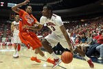 TUCSON, AZ - DECEMBER 10:  Kevin Parrom #3 of the Arizona Wildcats handles the ball under pressure from K.J. McDaniels #32 of the Clemson Tigers during the first half of the college basketball game at McKale Center on December 10, 2011 in Tucson, Arizona. The Wildcats defeated the Tigers 63-47.  (Photo by Christian Petersen/Getty Images)