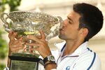 MELBOURNE, AUSTRALIA - JANUARY 30:  Novak Djokovic of Serbia poses with the Norman Brookes Challenge Cup after winning the 2012 men's Australian Open, at Carlton Gardens on January 30, 2012 in Melbourne, Australia.  (Photo by Lucas Dawson/Getty Images)