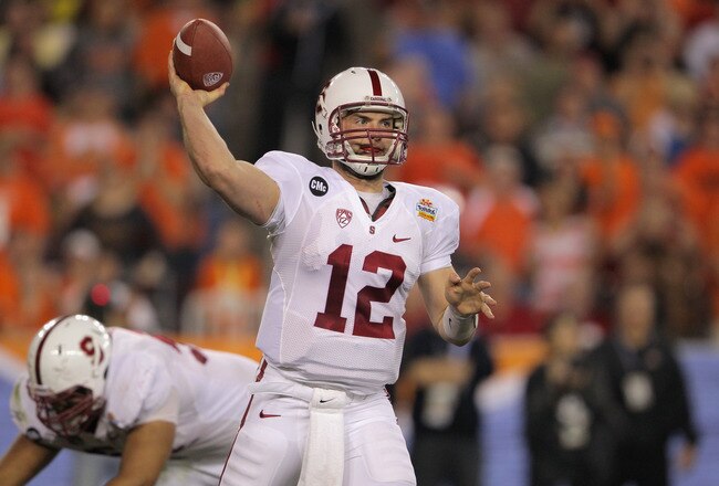 GLENDALE, AZ - JANUARY 02:  Andrew Luck #12 of the Stanford Cardinal throws a pass against the Oklahoma State Cowboys during the Tostitos Fiesta Bowl on January 2, 2012 at University of Phoenix Stadium in Glendale, Arizona. Oklahoma State won 41-38 in overtime.  (Photo by Doug Pensinger/Getty Images)