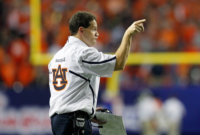 ATLANTA, GA - DECEMBER 31:  Head coach Gene Chizik of the Auburn Tigers points to his players during the 2011 Chick Fil-A Bowl against the Virginia Cavaliers at Georgia Dome on December 31, 2011 in Atlanta, Georgia.  (Photo by Kevin C. Cox/Getty Images)