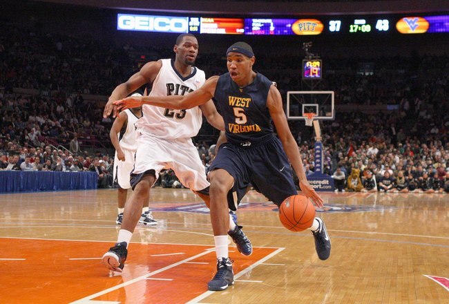 NEW YORK - MARCH 12:  Kevin Jones #5 of the West Virginia Mountaineers dribbles the ball against Sam Young #23 of the Pittsburgh Panthers during the second round of the Big East Tournament at Madison Square Garden on March 12, 2009 in New York City. (Photo by: Jim McIsaac/Getty Images)