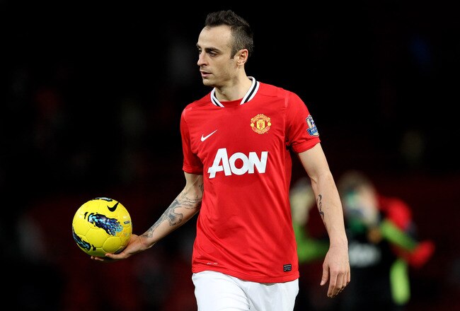 MANCHESTER, ENGLAND - DECEMBER 26:  Dimitar Berbatov of Manchester United walks off with the match ball after scoring a hat trick at the end of the Barclays Premier League match between Manchester United and Wigan Athletic at Old Trafford on December 26, 2011 in Manchester, England.  (Photo by Alex Livesey/Getty Images)
