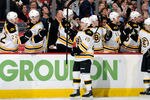 WASHINGTON, DC - JANUARY 24:  Rich Peverley #49 of the Boston Bruins celebrates with teammates after scoring in the first period against the Washington Capitals at the Verizon Center on January 24, 2012 in Washington, DC.  (Photo by Greg Fiume/Getty Images)