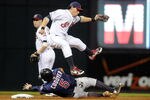 CLEVELAND, OH - SEPTEMBER 23: Shortstop Asdrubal Cabrera #13 of the Cleveland Indians leaps over Michael Cuddyer #5 of the Minnesota Twins who is out at second during the sixth inning at Progressive Field on September 23, 2011 in Cleveland, Ohio. (Photo by Jason Miller/Getty Images)