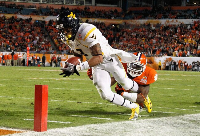 MIAMI GARDENS, FL - JANUARY 04:  Stedman Bailey #3 of the West Virginia Mountaineers scores a 3-yard touchdown reception in the third quarter against Bashaud Breeland #17 of the Clemson Tigers during the Discover Orange Bowl at Sun Life Stadium on January 4, 2012 in Miami Gardens, Florida.  (Photo by Mike Ehrmann/Getty Images)