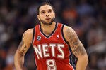 PHOENIX, AZ - JANUARY 13:  Deron Williams #8 of the New Jersey Nets in action during the NBA game against the Phoenix Suns at US Airways Center on January 13, 2012 in Phoenix, Arizona. The Nets defeated the Suns 110-103.   NOTE TO USER: User expressly acknowledges and agrees that, by downloading and or using this photograph, User is consenting to the terms and conditions of the Getty Images License Agreement.  (Photo by Christian Petersen/Getty Images)