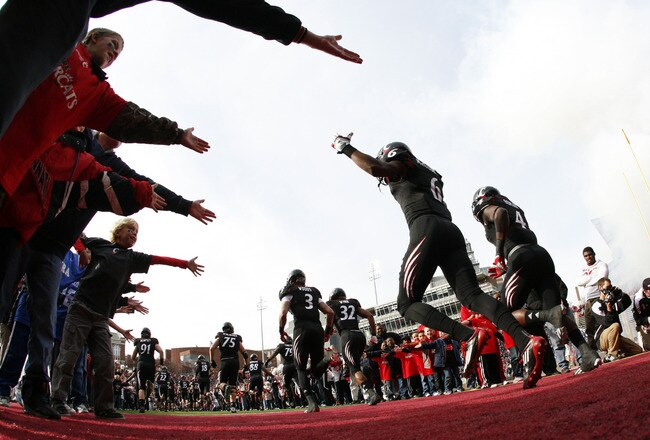 CINCINNATI, OH - DECEMBER 03:  Anthony McClung #6 of the Cincinnati Bearcats runs on the field before the start of the game against the Connecticut Huskies on December 3, 2011 at Nippert Stadium in Cincinnati, Ohio. The Bearcats defeated the Connecticut Huskies 35-27. (Photo by Tyler Barrick/Getty Images)