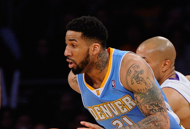 LOS ANGELES, CA - APRIL 03: Wilson Chandler #21 of the Denver Nuggets  drives past Derek Fisher #2 of the Los Angeles Lakers during the game at Staples Center on April 3, 2011 in Los Angeles, California. NOTE TO USER: User expressly acknowledges and agrees that, by downloading and or using this photograph, User is consenting to the terms and conditions of the Getty Images License Agreement.  (Photo by Kevork Djansezian/Getty Images)