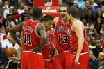 WASHINGTON, DC - JANUARY 30: Joakim Noah #13 of the Chicago Bulls talks with teammates Ronnie Brewer #11, Derrick Rose #1 and Kyle Korver #26 during the second half against the Washington Wizards at Verizon Center on January 30, 2012 in Washington, DC. NOTE TO USER: User expressly acknowledges and agrees that, by downloading and or using this photograph, User is consenting to the terms and conditions of the Getty Images License Agreement.  (Photo by Rob Carr/Getty Images)