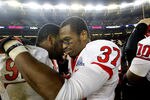NEW YORK - DECEMBER 30:  (L-R) Jamil Merrell #92 and Jamal Merrell #37 of the Rutgers Scarlet Knights celebrate a win over the Iowa State Cyclones in the New Era Pinstripe Bowl at Yankee Stadium on December 30, 2011 in the Bronx Borough of New York City.  (Photo by Jeff Zelevansky/Getty Images)