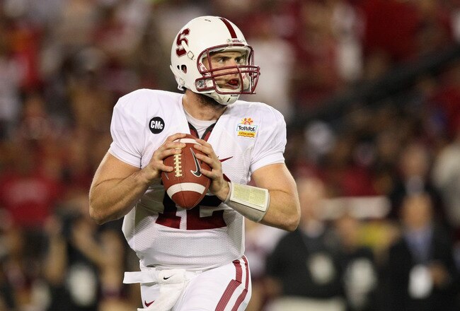 GLENDALE, AZ - JANUARY 02:  Quarterback Andrew Luck #12 of the Stanford Cardinal looks to pass against the Oklahoma State Cowboys during the Tostitos Fiesta Bowl on January 2, 2012 at University of Phoenix Stadium in Glendale, Arizona.  (Photo by Donald Miralle/Getty Images)
