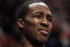 CHICAGO, IL - JANUARY 28: Dwight Howard #12 of the Orlando Magic reacts to the taunts of a fan as he sits on the bench during a game against the Chicago Bulls at the United Center on January 28, 2011 in Chicago, Illinois. NOTE TO USER: User expressly acknowledges and agrees that, by downloading and/or using this photograph, User is consenting to the terms and conditions of the Getty Images License Agreement. (Photo by Jonathan Daniel/Getty Images)