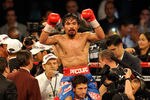 LAS VEGAS, NV - NOVEMBER 12:  Manny Pacquiao celebrates his majority decision victory against Juan Manuel Marquez in the WBO world welterweight title fight at the MGM Grand Garden Arena on November 12, 2011 in Las Vegas, Nevada.  (Photo by Ethan Miller/Getty Images)