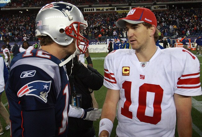 FOXBORO, MA - NOVEMBER 6:    Tom Brady #12 of the New England Patriots congratulates  Eli Manning #10 of the New York Giants after the New York Giants 24-20 win on November 6, 2011 in Foxboro, Massachusetts. (Photo by Jim Rogash/Getty Images)