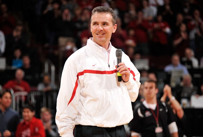 COLUMBUS, OH - JANUARY 15:  Head football coach Urban Meyer of the Ohio State Buckeyes is introduced to the crowd at halftime of the basketball game between the Indiana Hoosiers and the Ohio State Buckeyes on January 15, 2012 at Value City Arena in Columbus, Ohio.  (Photo by Jamie Sabau/Getty Images)