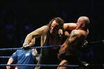 SYDNEY, AUSTRALIA - JUNE 15:  The Undertaker (L) pushes Bam Neely into the corner during WWE Smackdown at Acer Arena on June 15, 2008 in Sydney, Australia.  (Photo by Gaye Gerard/Getty Images)
