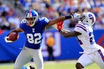 EAST RUTHERFORD, NJ - OCTOBER 16:  Mario Manningham #82 of the New York Giants pushes off  Terrence McGee #24 of the Buffalo Bills at MetLife Stadium on October 16, 2011 in East Rutherford, New Jersey.  (Photo by Chris Trotman/Getty Images)