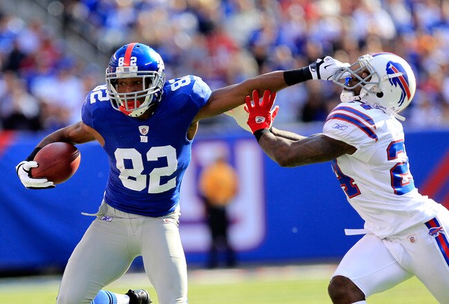 EAST RUTHERFORD, NJ - OCTOBER 16:  Mario Manningham #82 of the New York Giants pushes off  Terrence McGee #24 of the Buffalo Bills at MetLife Stadium on October 16, 2011 in East Rutherford, New Jersey.  (Photo by Chris Trotman/Getty Images)