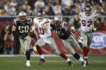 GLENDALE, AZ - FEBRUARY 03:  Quarterback Eli Manning #10 of the New York Giants runs from the New England Patriots during Super Bowl XLII on February 3, 2008 at the University of Phoenix Stadium in Glendale, Arizona.  (Photo by Andy Lyons/Getty Images)
