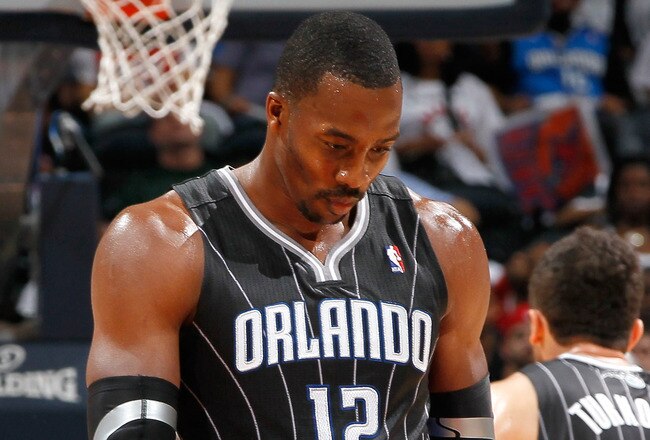 ATLANTA, GA - APRIL 24:  Dwight Howard #12 of the Orlando Magic walks downcourt after a turnover to the Atlanta Hawks during Game Four of the Eastern Conference Quarterfinals in the 2011 NBA Playoffs at Philips Arena on April 24, 2011 in Atlanta, Georgia.  NOTE TO USER: User expressly acknowledges and agrees that, by downloading and or using this photograph, User is consenting to the terms and conditions of the Getty Images License Agreement.  (Photo by Kevin C. Cox/Getty Images)