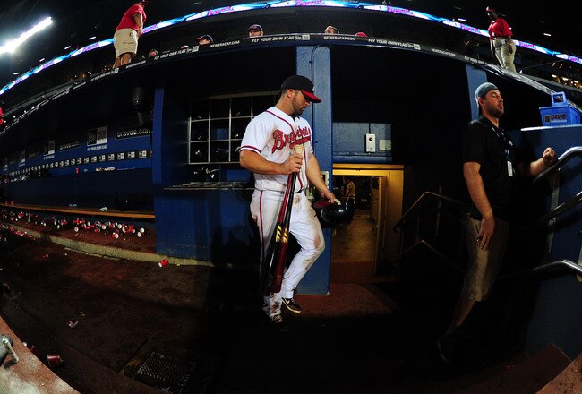 ATLANTA - SEPTEMBER 28: Dan Uggla #26 of the Atlanta Braves leaves the dugout after the game against the Philadelphia Phillies at Turner Field on September 28, 2011 in Atlanta, Georgia. (Photo by Scott Cunningham/Getty Images)