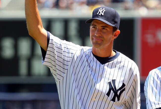 NEW YORK - JULY 19:  New York Yankee Mike Mussina waves to the crowd during the teams 63rd Old Timers Day before the game against the Detroit Tigers on July 19, 2009 at Yankee Stadium in the Bronx borough of New York City.  (Photo by Jim McIsaac/Getty Images)