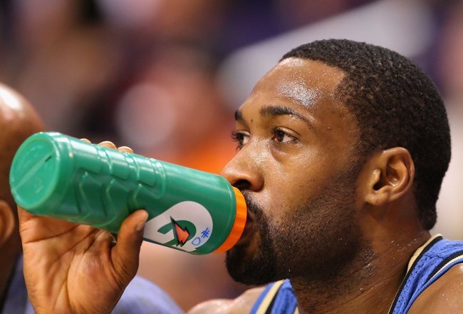 PHOENIX - DECEMBER 19:  Gilbert Arenas #0 of the Washington Wizards drinks water during the NBA game against the Phoenix Suns at US Airways Center on December 19, 2009 in Phoenix, Arizona. The Suns defeated the Wizards 121-95. NOTE TO USER: User expressly acknowledges and agrees that, by downloading and or using this photograph, User is consenting to the terms and conditions of the Getty Images License Agreement.  (Photo by Christian Petersen/Getty Images)