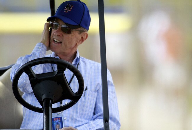 PORT ST. LUCIE, FL - FEBRUARY 17: Owner Fred Wilpon of the New York Mets talks on the phone during spring training at Tradition Field on February 17, 2011 in Port St. Lucie, Florida.  (Photo by Marc Serota/Getty Images)