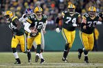 GREEN BAY, WI - JANUARY 15:   Aaron Rodgers #12 of the Green Bay Packers runs the ball against the New York Giants during their NFC Divisional playoff game at Lambeau Field on January 15, 2012 in Green Bay, Wisconsin.  (Photo by Jamie Squire/Getty Images)