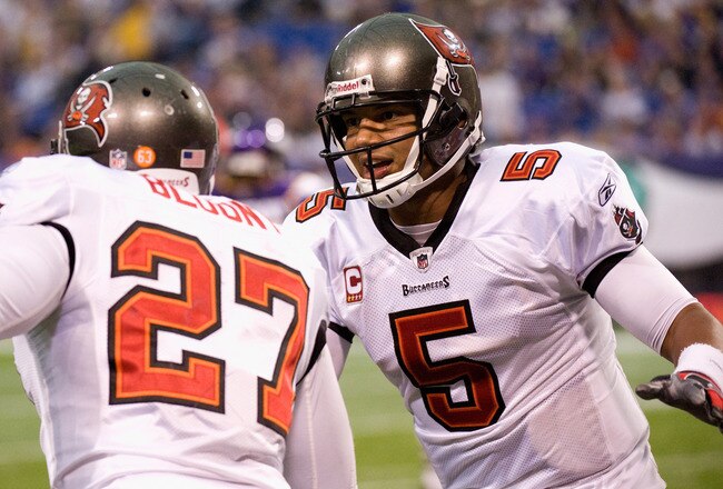 MINNEAPOLIS, MN - SEPTEMBER 18: Josh Freeman #5 and LeGarrette Blount #27 of the Tampa Bay Buccaneers celebrate a touchdown against the Minnesota Vikings in the third quarter on September 18, 2011 at Hubert H. Humphrey Metrodome in Minneapolis, Minnesota. (Photo by Hannah Foslien/Getty Images)