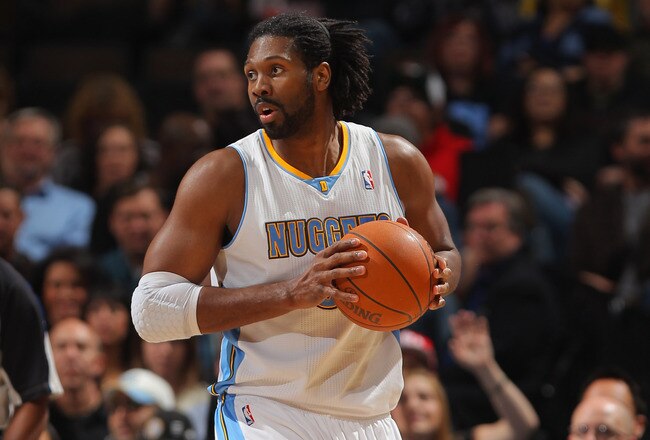 DENVER, CO - JANUARY 09:  Nene Hilario #31 of the Denver Nuggets controls the ball against the New Orleans Hornets at the Pepsi Center on January 9, 2012 in Denver, Colorado. The Hornets defeated the Nuggets 94-81. NOTE TO USER: User expressly acknowledges and agrees that, by downloading and or using this photograph, User is consenting to the terms and conditions of the Getty Images License Agreement.  (Photo by Doug Pensinger/Getty Images)