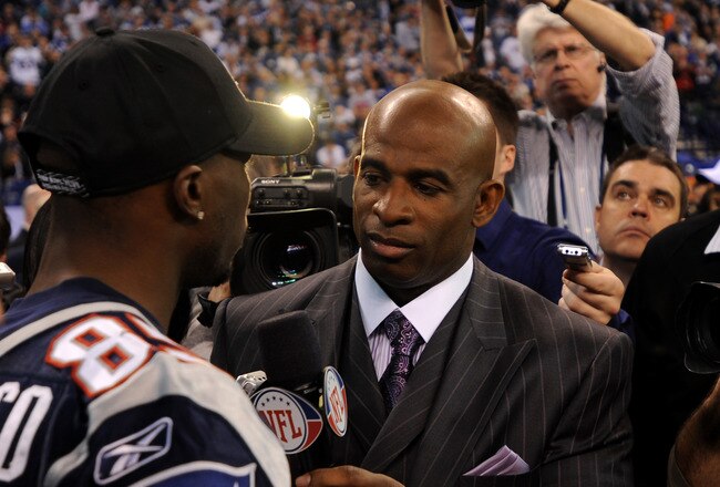 INDIANAPOLIS, IN - JANUARY 31:  Chad Ochocinco #85 of the New England Patriots answers questions from Dieon Sanders from the NFL network during Media Day ahead of Super Bowl XLVI against the New York Giants at Lucas Oil Stadium on January 31, 2012 in Indianapolis, Indiana.  (Photo by Michael Heiman/Getty Images)