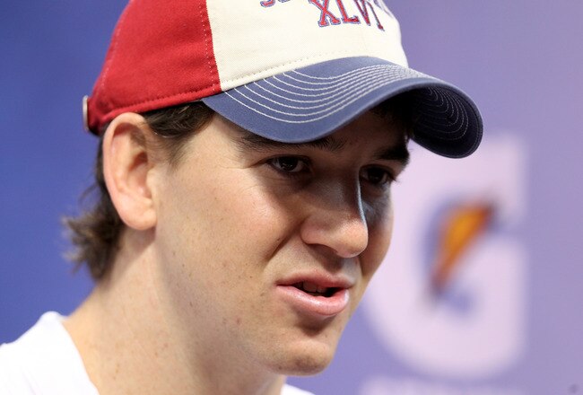 INDIANAPOLIS, IN - JANUARY 31:  Quarterback Eli Manning #10 of the New York Giants answers question from the media during Media Day ahead of Super Bowl XLVI against the New England Patriots at Lucas Oil Stadium on January 31, 2012 in Indianapolis, Indiana.  (Photo by Andy Lyons/Getty Images)