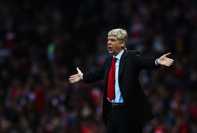 LONDON, ENGLAND - DECEMBER 31:  Arsene Wenger the Arsenal manager reacts on the touchline during the Barclays Premier League match between Arsenal and Queens Park Rangers at the Emirates Stadium on December 31, 2011 in London, England.  (Photo by Clive Mason/Getty Images)