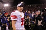 SAN FRANCISCO, CA - JANUARY 22:  Eli Manning #10 of the New York Giants walks off of the field after the Giants won 20-17 in overtime against the San Francisco 49ers during the NFC Championship Game at Candlestick Park on January 22, 2012 in San Francisco, California.  (Photo by Doug Pensinger/Getty Images)