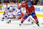 MONTREAL, CANADA - JANUARY 15:  David Desharnais #51 of the Montreal Canadiens stick handles the puck in front of Stu Bickel #41 of the New York Rangers during the NHL game at the Bell Centre on January 15, 2012 in Montreal, Quebec, Canada.  (Photo by Richard Wolowicz/Getty Images)