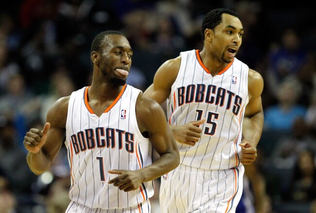 CHARLOTTE, NC - JANUARY 14:  Teammates Kemba Walker and Gerald Henderson #15 of the Charlotte Bobcats celebrate against the Golden State Warriors during their game at Time Warner Cable Arena on January 14, 2012 in Charlotte, North Carolina.  NOTE TO USER: User expressly acknowledges and agrees that, by downloading and or using this photograph, User is consenting to the terms and conditions of the Getty Images License Agreement.  (Photo by Streeter Lecka/Getty Images)